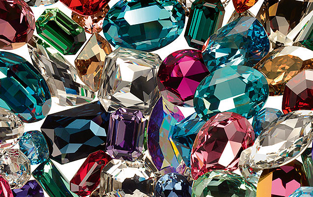Burst of colorful crystals in greens, pinks, purples, yellows, blues and clear. 