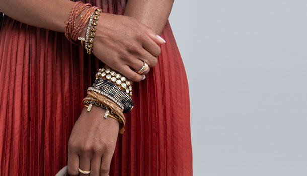 Woman wearing Brass Ox, Gold and crystal bracelets
