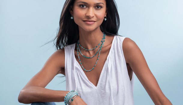 Woman wearing aqua jewelry